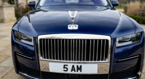 Blue Rolls Royce with 5 AM number plate