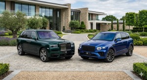 A Rolls Royce Cullinan parked next to a Bentley Bentaga.